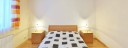 ložnice v malém apartmá